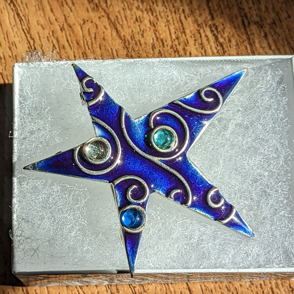 Blue enameled and silver brooch